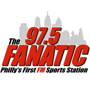 Logo for 97.5 The Fanatic, Philly's First FM Sports Station, with a gray city skyline backdrop. 